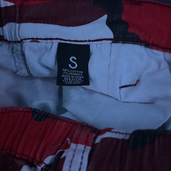 These are red camo print baggy cargo pants. Size small. Only work once. - Picture 3 of 3